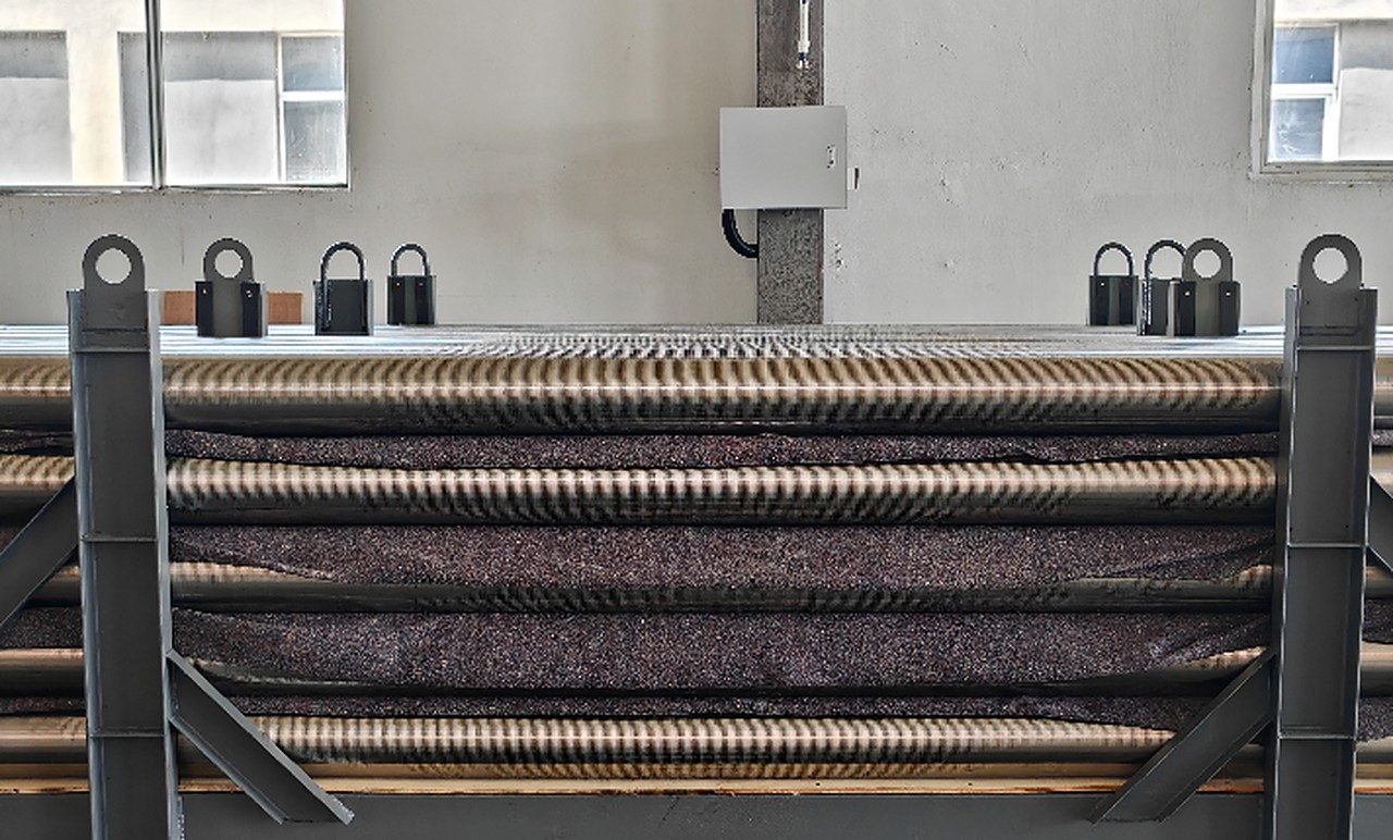 Wire wrapped screen pipes arranged in production racks