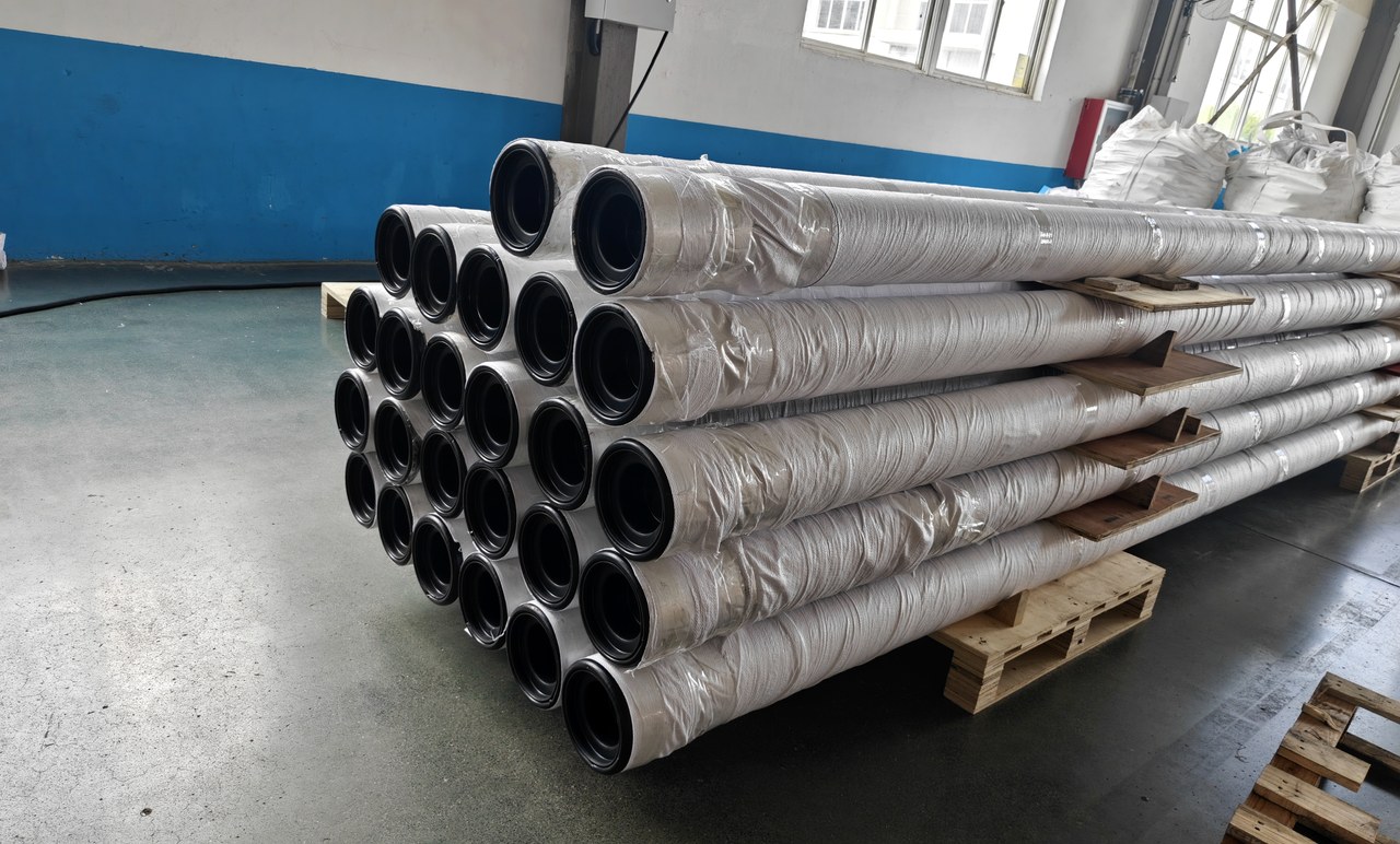 Wire wrapped screen pipes arranged in production racks