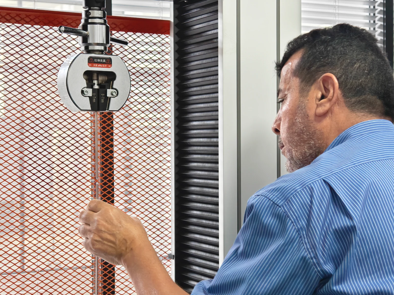 International customer witnessing a tensile test of screen wire